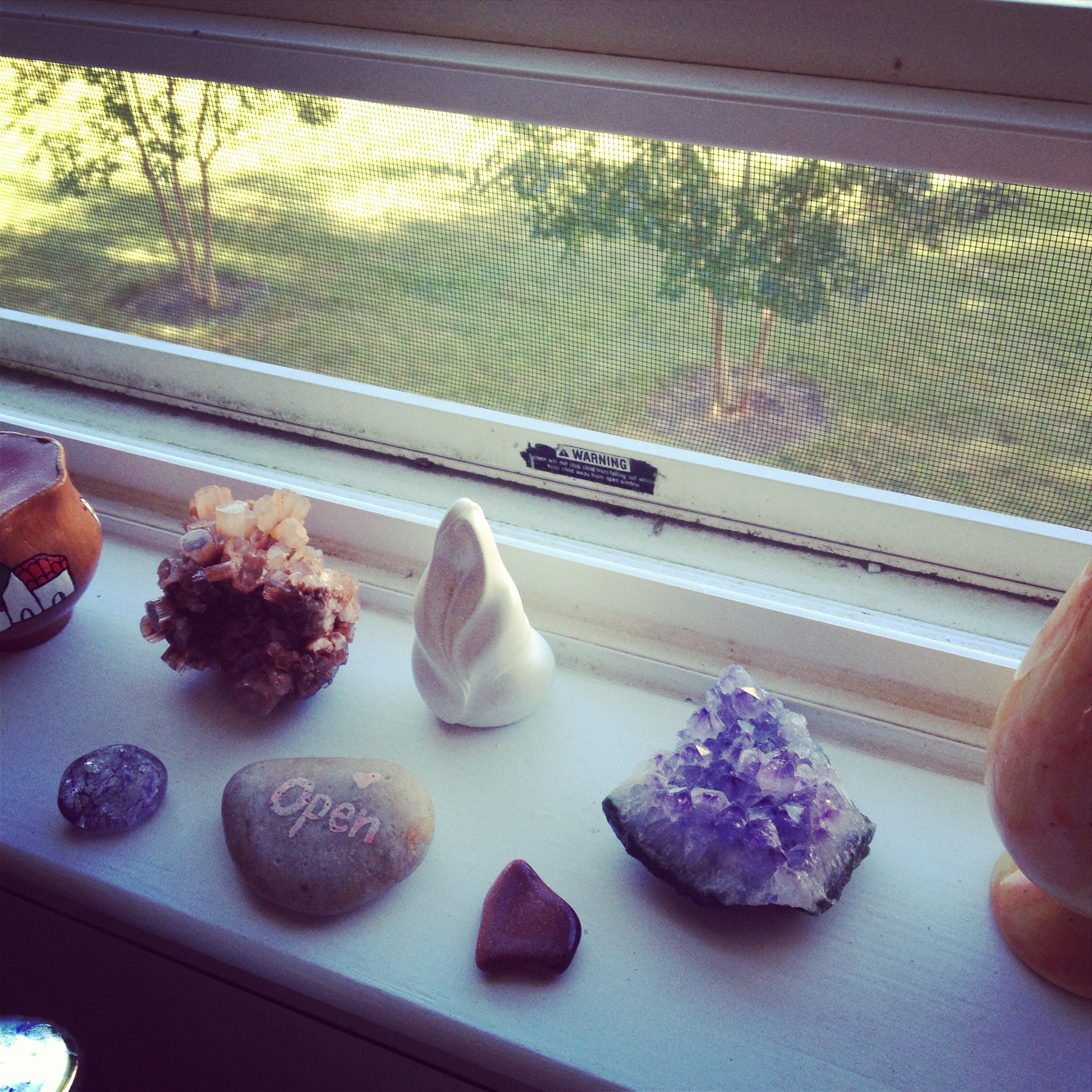 a sacred space over the kitchen sink that reminds me of the holy, centers me, reminds me to breathe while I'm doing dishes
