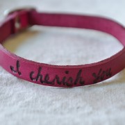 poetic leather wrist wrap, vibrant jewel tones, magenta